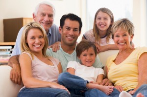 Extended family in living room smiling